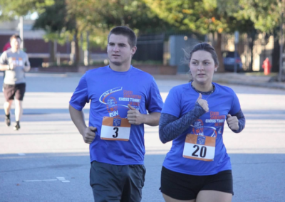 man and woman running side by side